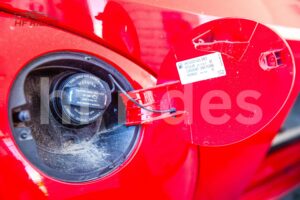  Close-up of car fuel tank area with open fuel door
