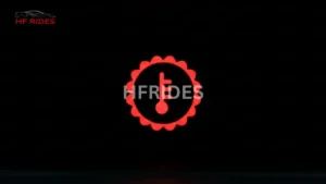 A car transmission temperature light focused in a dark background