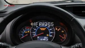 Dashboard featuring a speedometer and various gauges, displaying vehicle performance metrics. - How to reset dashboard lights on Toyota yaris